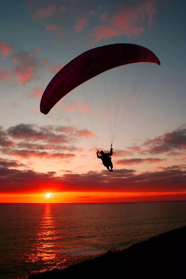 How is paragliding different than hang gliding?